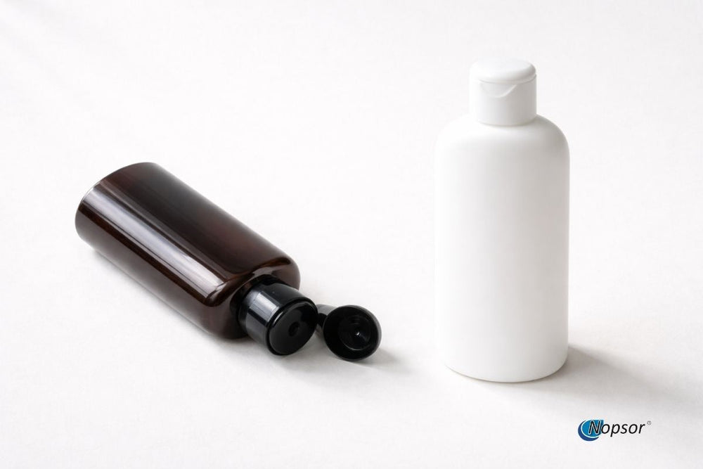 Two bottles, one brown and one white, on a light gray background with 'Nopsor' branding.