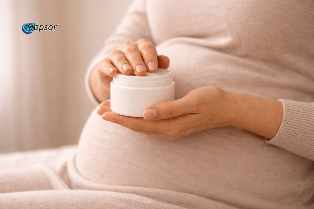 Person holding a white jar with a blurred background