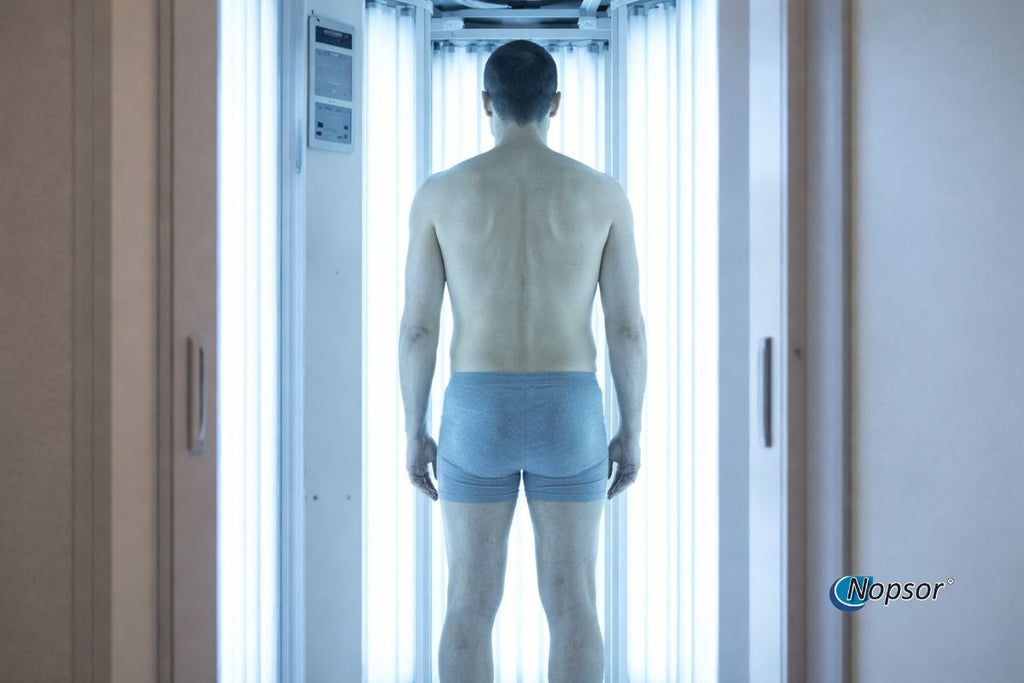 Person standing inside a white chamber with 'Nopsor' branding.